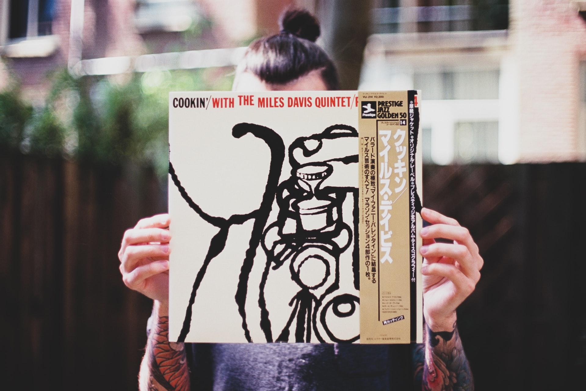 person showing a vinyl record album