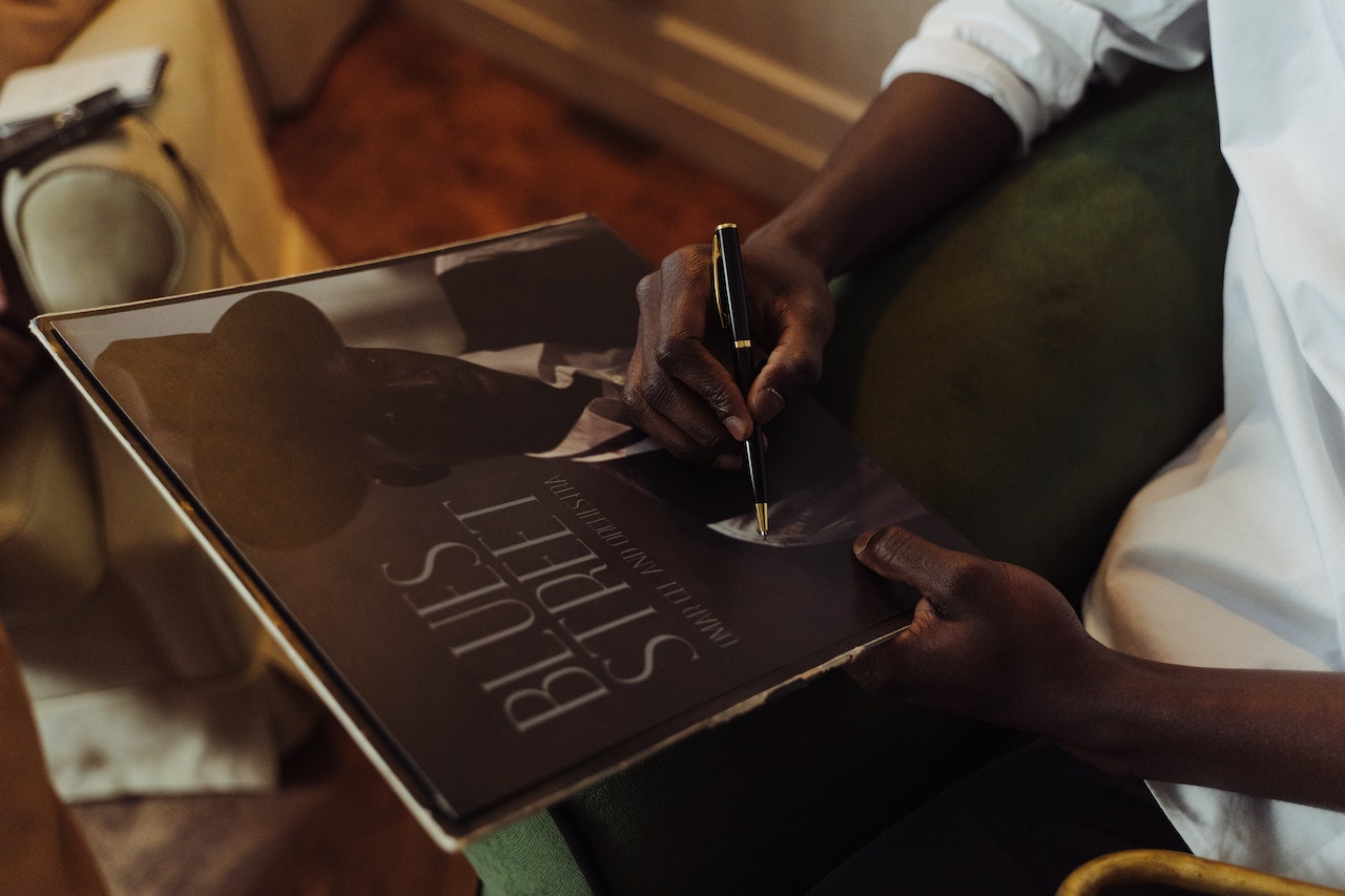 artist signing vinyl record